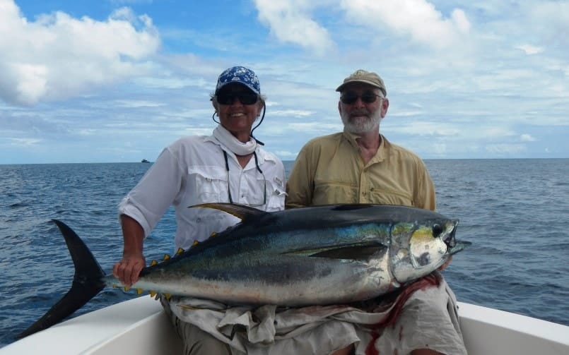 A Man and A Woman holds Yellowfin Fish img | Panama Fishing Report – The Mothership Part II